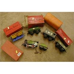 A Hornby O Gauge side tipping wagon, another wagon, oil tanker, engines etc (boxed) £50-60