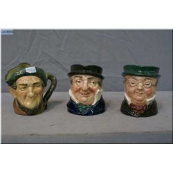 Three small Royal Doulton character jugs including Mr. Pickwick , Auld Mac Bang Went Saxpence, and C