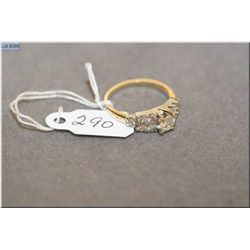 Ladies vintage 14kt yellow and white gold diamond ring set with center .29ct brilliant white diamond