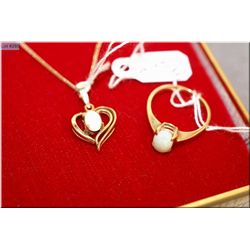 Ladies 10kt yellow gold and opal ring and a 10kt yellow gold opal pendant and chain
