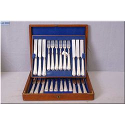 Antique cased silverplate flatware for twelve