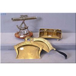 A vintage brass ink well, two piece tidy betty and a modern decorator sextant
