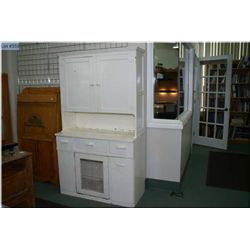 Primitive kitchen cabinet with multiple drawers and cupboards