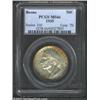 Image 1 : 1935 50C Boone MS66 PCGS. Rich orange-red iridescence hugs the rims in a mottled fashion. The balanc