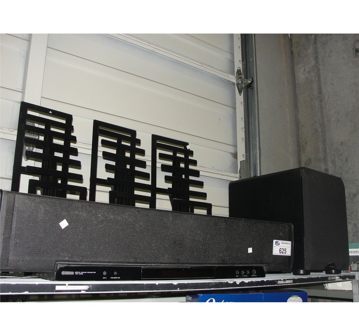YAMAHA SOUND BAR AND PARADIGM SUBWOOFER AND 3 MAGAZINE RACKS