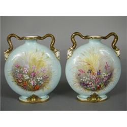 A pair of 19th century Grainger & Co porcelain moon flask vases, decorated with hand painted flor...