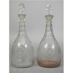 A good pair of George III cut glass decanters with lunar cut lozenge stoppers, with an engraved c...