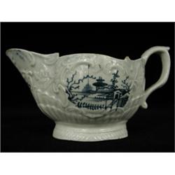 A Liverpool blue and white sauce boat, late 18th century (some cracking), 8cm high Est. 150/200...