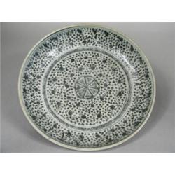 A Ming period blue and white dished charger with stylised foliate decoration throughout, 32.5cm d...