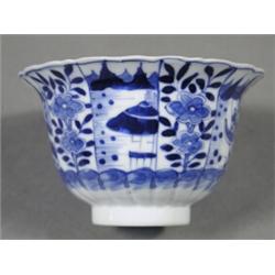 A Chinese blue and white part fluted bowl with flaring rim, 'V.O.C.' (?) mark to underside Est. 5...