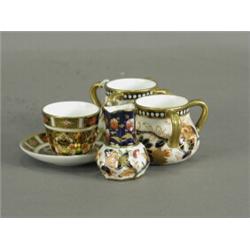 A pair of miniature coalport four handled vases, 41cm high; an ironstone style jug, 5cm high, and...