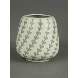 A Poole pottery free form vase of tapering cylindrical form, with alternating strips of foliage a...
