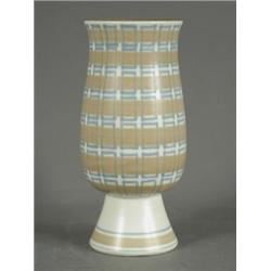 A Poole pottery free form vase, of slender tapering form on a low foot, decorated with bands of b...