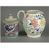 Image 1 : Two Poole pottery items: A pot and cover and a milk jug (2) Est. 120/150...