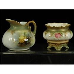 A small Hadleys Royal Worcester jug painted on each side with roses, together with a small jardin...