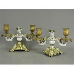 A pair of porcelain and gilt bronze twin branch candlesticks, 13cm Est. 150/200...