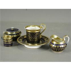 Four pieces of 19th century Paris porcelain, each in a blue glaze with gilt edge and trailing Est...