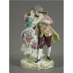A 19th century French porcelain figure group, with lace trimming, 21.5cm Est. 150/200...
