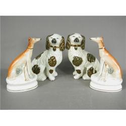 A pair of Staffordshire lurchers with hares, and a pair of Staffordshire dogs, with lustre patche...