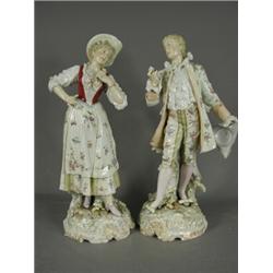 A pair of Volkstedt porcelain figures of an 18th century couple, (some damage), 43cm high Est. 15...