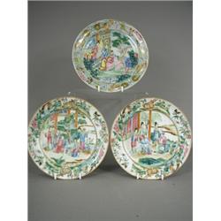 A pair of Cantonese plates, decorated with figures, and another with a border of animals and flow...