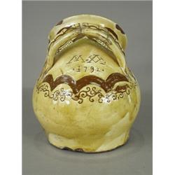 A Sussex slipware salt pot, with scraffito decoration, initialled M.A. and dated 1792 (restored h...