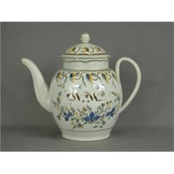 An 18th century pearlware pratt style punch pot, initials to body W.W., decorated with floral gar...