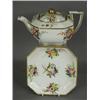Image 1 : A Spode octagonal teapot on a stand, with moulded decoration, painted with floral sprays and gilt...
