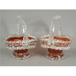 Two ruby glass baskets (one with slight damage), 26cm high Est. 150/200...