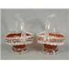 Image 1 : Two ruby glass baskets (one with slight damage), 26cm high Est. 150/200...
