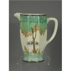 A Clarice Cliff Athens jugs, decorated with trees and flowers, base with signature mark, 15.5cm h...