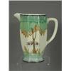 Image 1 : A Clarice Cliff Athens jugs, decorated with trees and flowers, base with signature mark, 15.5cm h...
