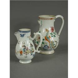 Two 18th/19th century Famille Rose jugs with enamelled decoration (both with damage), tallest 23c...