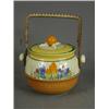 Image 1 : A Clarice Cliff crocus pattern biscuit barrel and lid with a wicker swing handle, base impressed...