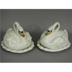A pair of 19th century Staffordshire pottery swans (covered dishes), each 20cm high Est. 300/400...