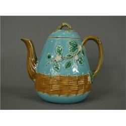 A George Jones majolica teapot, with registration mark, monogram and stamped A3, (chipped and hai...