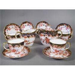 An early Edwardian Royal Crown Derby Imari pattern six place coffee set, with cream jug and sucri...