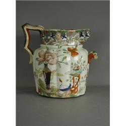 A large 19th century Masons Patent Ironstone china footbath jug, with relief serpent mask handle...