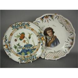 An 18th century polychrome decorated Delft plate, together with a Rouen plate, 22 and 25cm diamet...