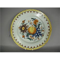 A Dutch 18th century polychrome charger, decorated with fruit and flowers, 34.5cm diameter Est. 2...