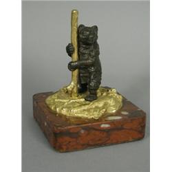 A 19th century Russian bronze and gilt figure of a standing bear, raised on a mottled marble base...