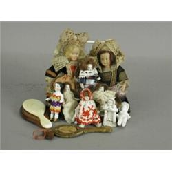 Ten miniature dolls and three dolls looking glasses, one micro mosaic, one ivory and one wooden E...