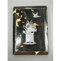 A 19th century tortoiseshell card case with an inlaid engraved silver work picture, 10.7 x 7.6cm...