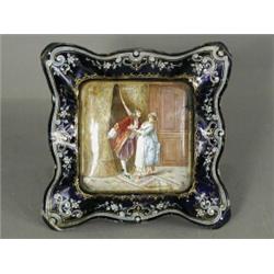 A 19th century Limoges enamel tray, decorated with an aristocrat surprising a maid, monogrammed F...