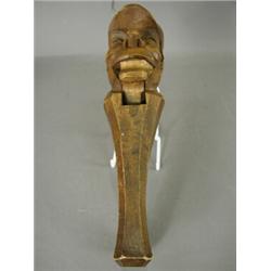 A carved softwood nut cracker, 25cm high Est. 80/120...