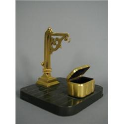 A late 19th century gilt and bronze watch stand with a miniature 'luggage' key box, 14cm high Est...