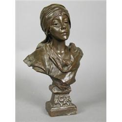 A bronze bust of a gypsy girl titled 'Agar', cast from the model by Villanis, signed E. Villanis,...