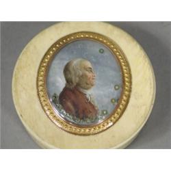 A George III ivory veneered snuff box with a tortoiseshell interior, the lid with a profile of a...