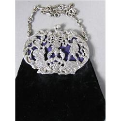 An early Edwardian silver mounted purse hallmarked London 1902, makers initials S.J. Est. 150/200...