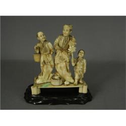 A late 19th century Meiji period carved ivory figure group okimono (A/F some loose pieces) blacke...